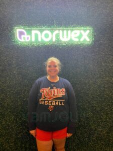 Emily Munns holding her Norwex sign