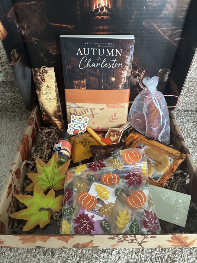 The opened PR package from author Ann Morrison with Autumn in Charleston and fall-themed goodies